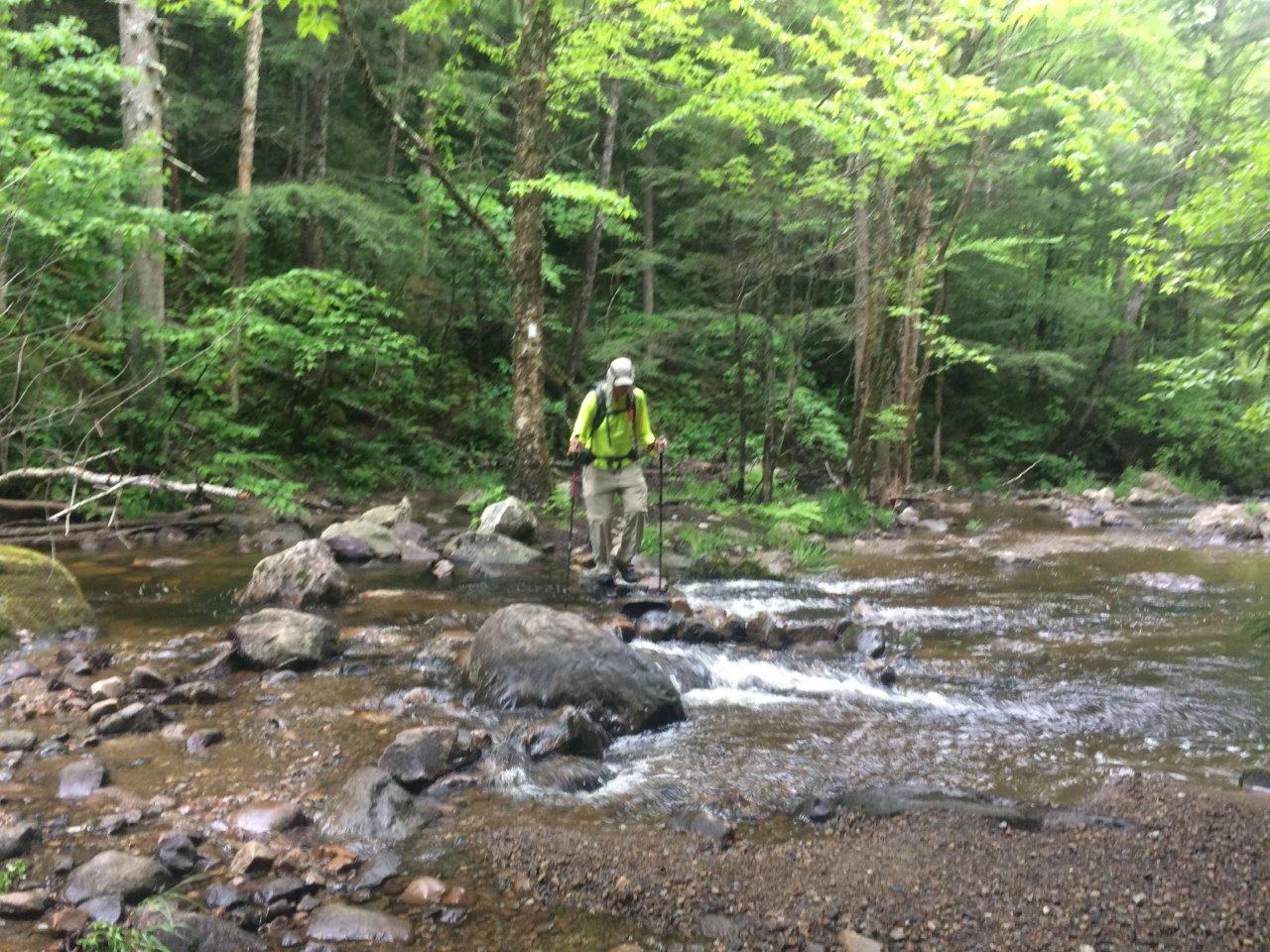 Lightened Up crossing a creek on the trail to Killington.